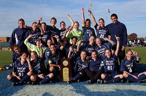 Women's Soccer team celebrating their championship 2004