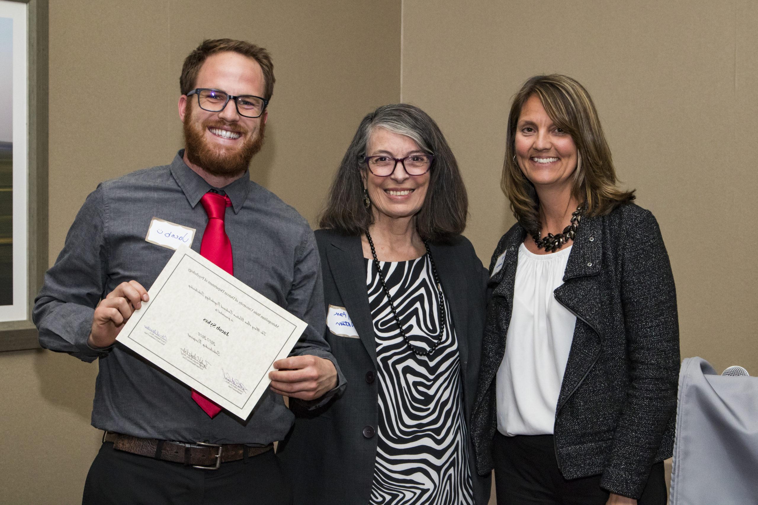 Drs. Sanders and Watson with the recipient of a scholarship.